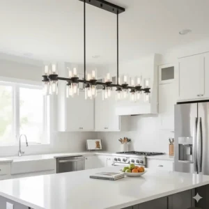 Clear glass shade linear chandelier with multiple lights centered over a kitchen island workspace.