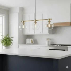 Elegant polished chrome 3-light pendant fixture hanging over a navy blue kitchen island with quartz countertops.