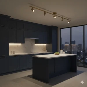 Elegant brushed brass track lighting heads accenting a luxury kitchen with navy blue cabinetry.