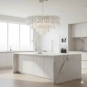 A luxury crystal chandelier adding a touch of formal elegance to a contemporary white kitchen island.