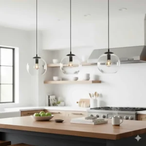 Three matching glass globe pendant lights spaced evenly across a wood-top kitchen island.