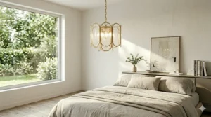 Soft ambient lighting from a small modern brass chandelier in a minimalist master bedroom.
