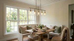 A modern farmhouse chandelier with clear glass cylinder shades and a brushed nickel finish.