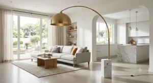 Brushed brass arc lamp with a heavy white Carrara marble base in an open concept home
