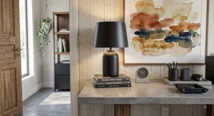 Matte black ceramic table lamp illuminating a contemporary home office desk