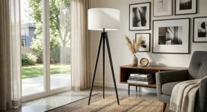 Modern black metal mid-century tripod lamp with a textured white drum lampshade.