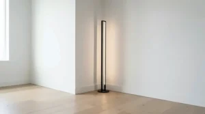 Black metal torchiere lamp for corner arrangement in a stylish downtown apartment.