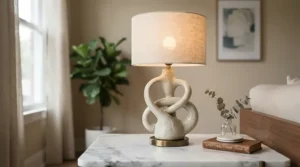 An artistic sculptural modern bedside table lamp for master bedroom acting as a decorative accent piece.